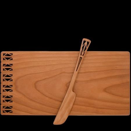 Cheese board and spreader with architectural design, made of cherry wood.