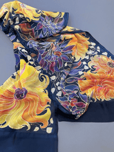 Load image into Gallery viewer, Yellow orange sunflowers painted on deep blue silk with accents of purples and reds
