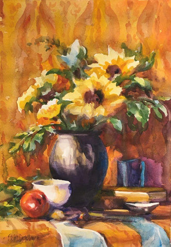 Golden sunflowers in a dark vase, a red apple and white cup make a simple and warm gathering .