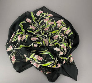 Deep pink Indian Paintbrush flowers bloom with graceful green leaves hand painted on sheer black silk