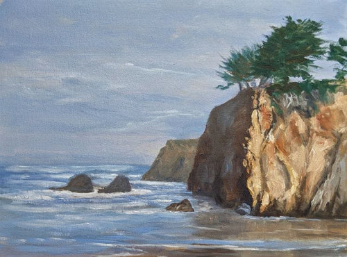 Northern California Headlands with green cypress overlooking the calm blue sea