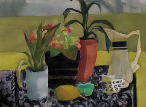 yellowgreen with orange vase and patterned tablecloth