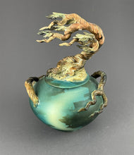 Load image into Gallery viewer, cypress sculpture on a covered jar, wood tones, teal and green jar
