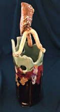 Load image into Gallery viewer, ceramic vase with branch and screech owl atop. Brown/black tenmoku and pale green celedon with red and gold glazes.

