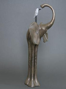 cast bronze curious long-legged elephant with her pal, a white egret, perched on her back. Bronze patina with black and white.