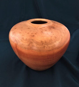This redgum eucalyptus vessel, with lighter figured top and striped lower portion in deep red tones, is striking in form, color and figure.