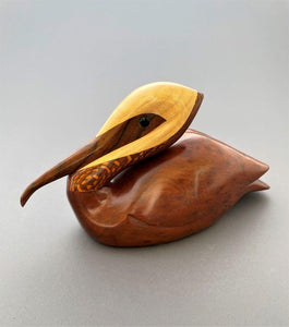 Pelican sculpture of redwood burl, lacewood, maple and walnut