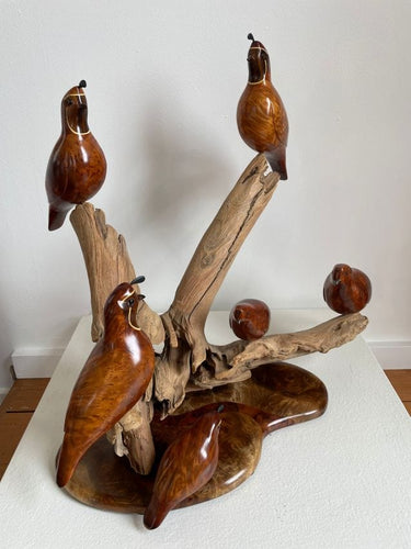 Large sculpture of six redwood burl quail perched on dripwood and a base of inlaid, figured woods