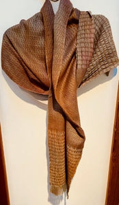 Wool silk and rayon make this shawl soft and silky while the soft earth and sky tones keep it natural.