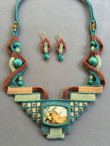 tapestry necklace with picture jasper centerpiece  stone, in leaf green, seafoam and rust tapestry, with turquoise, carnelian and gasparite beads.