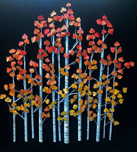 Bronze and copper aspen trees with colorful red and yellow leaves