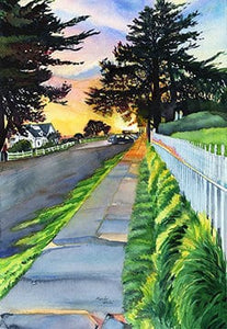 green, green grass gows along a bumpy sidwalk sparkling with recent rain, looking past the trees to the golden sunset