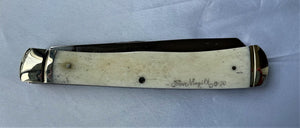 scrimshaw knife with rainbow trout, back