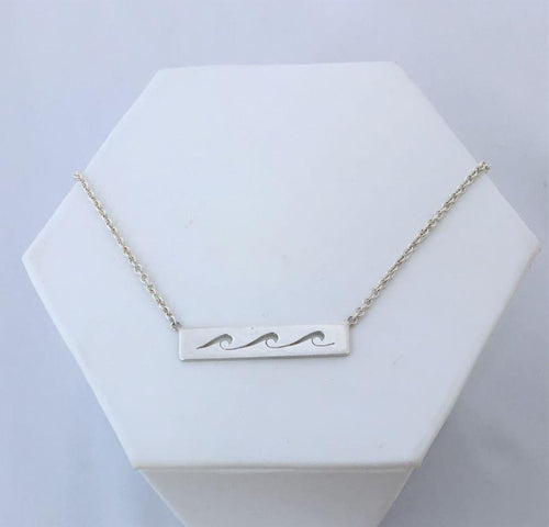 waves necklace. Three cut out waves roll across a sterling silver bar with silver chain