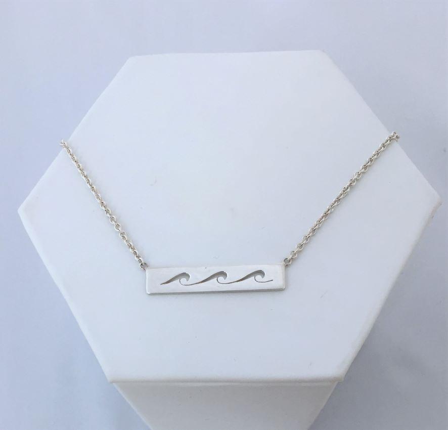 waves necklace. Three cut out waves roll across a sterling silver bar with silver chain