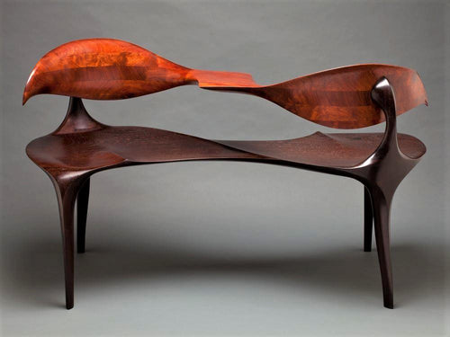 Tete-a-tete, or face-to-face, a bench for intimate conversations. Carved African mahogany and wenge.